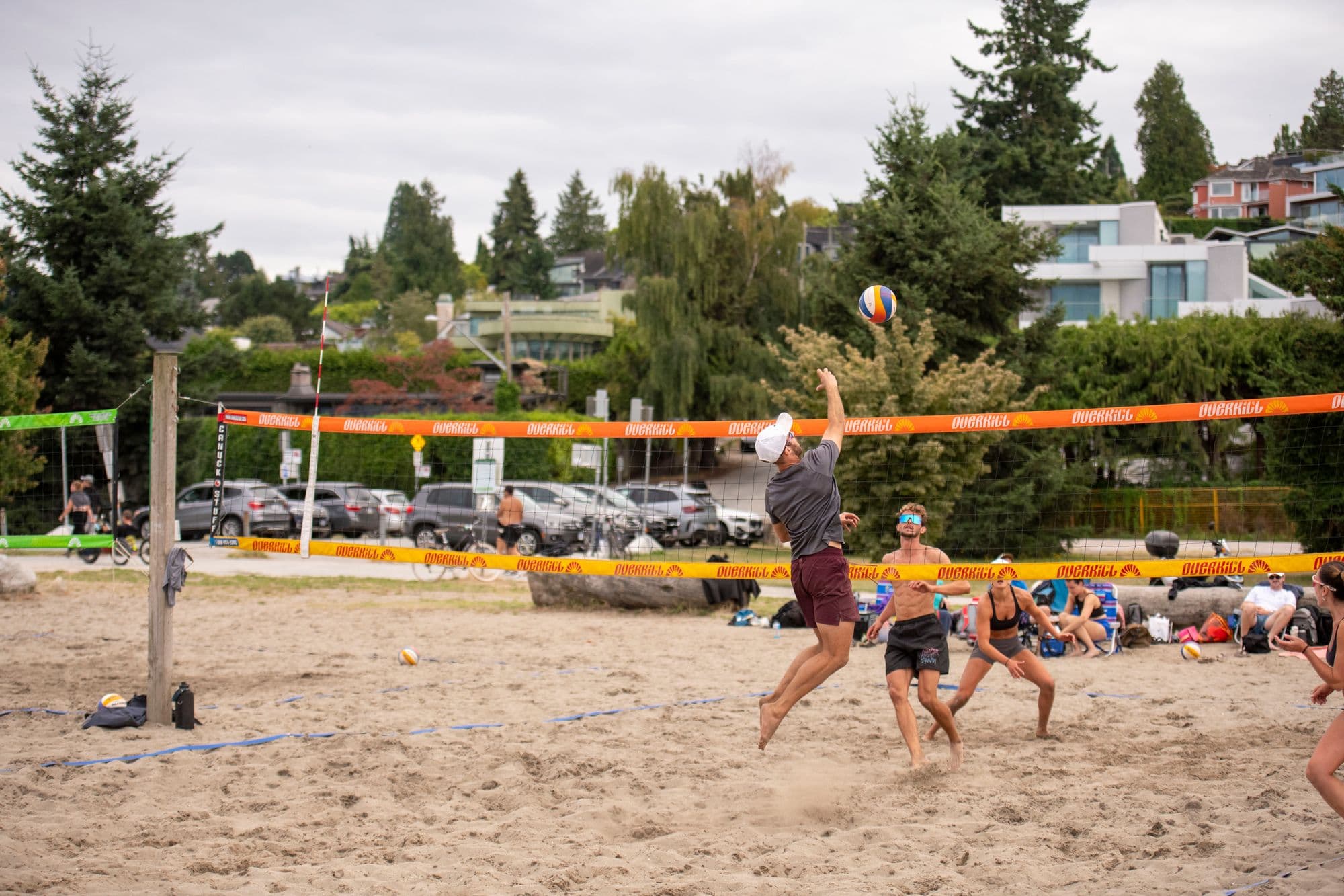 Beach volleyball player mid-play